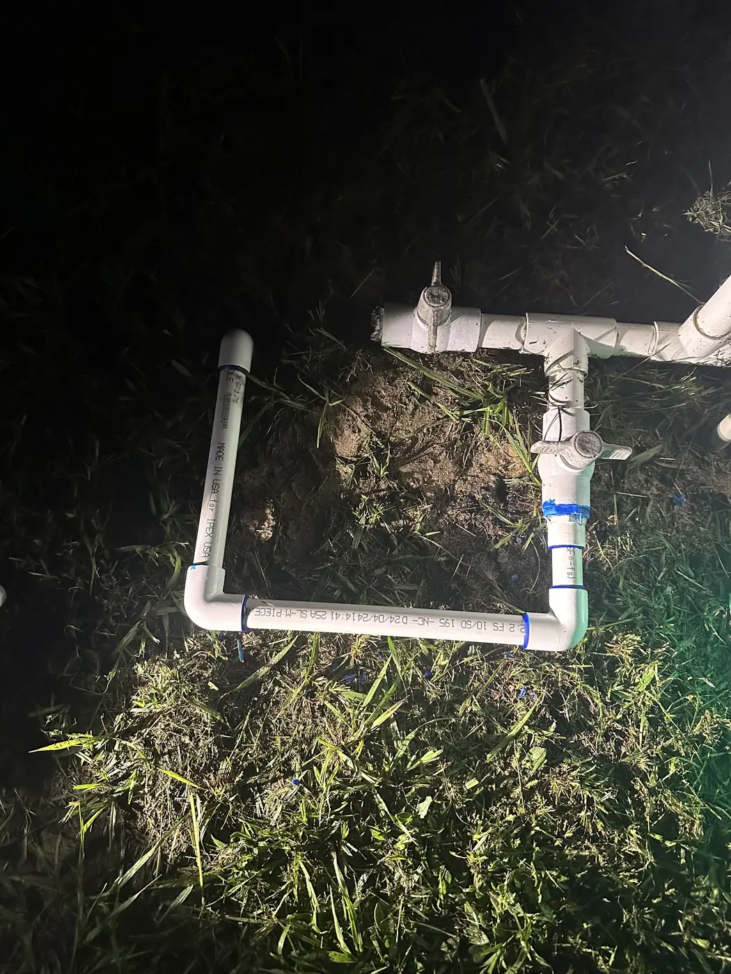 After-dark repair on a broken water line at a well